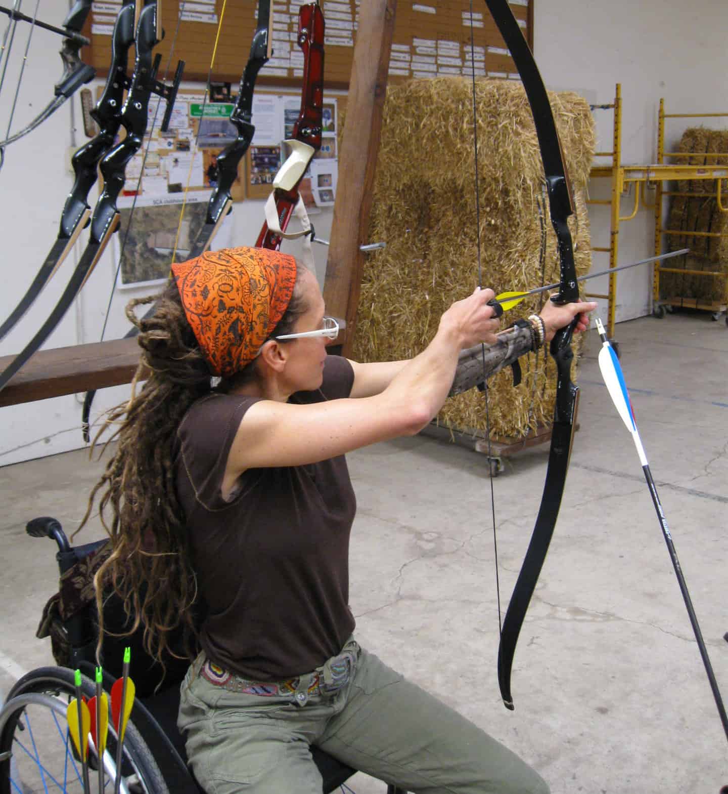 IMG_5859 Lady in wheelchair shooting arrows at a pratice target.