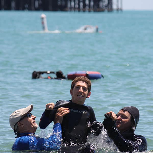 donate-scuba-diving boy with autism playing in ocean