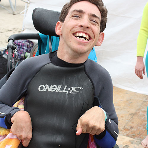 day-on-the-beach-brandon-smiling-by-jeanie-olsen day on the beach autism and joy